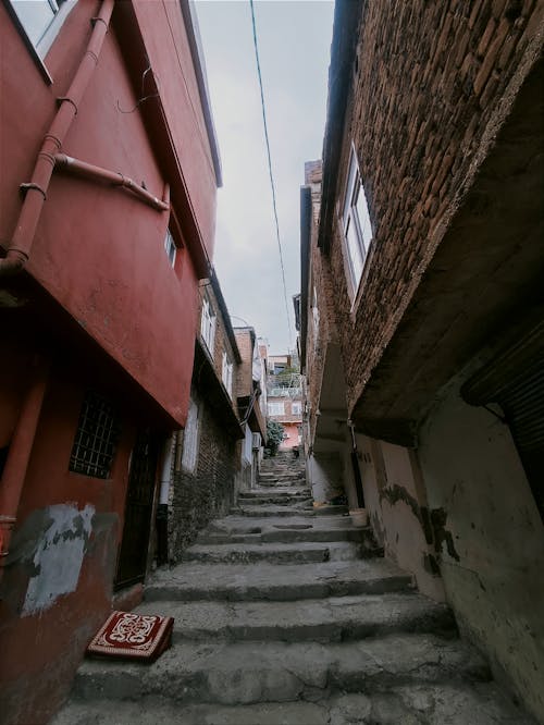 Stairs in Narrow Alley between Houses