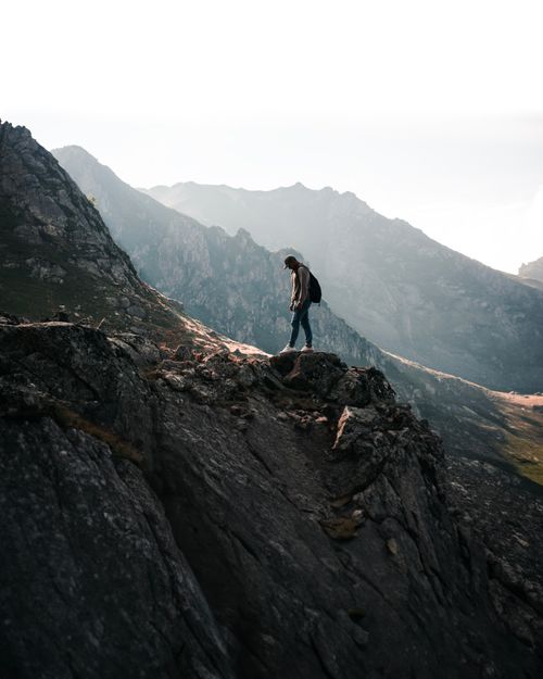 Free Hiker explores rugged terrain in Artvin, Türkiye, with mountainous backdrop. Stock Photo
