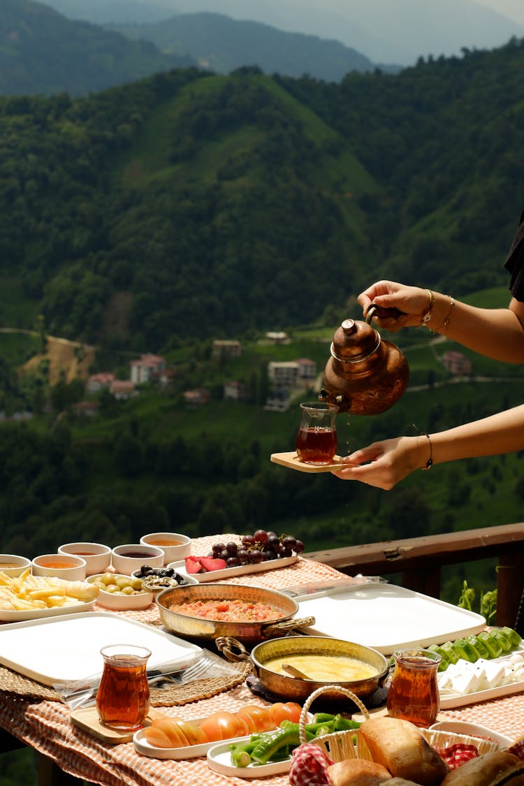 Woman Hands Over Table With Breakfast