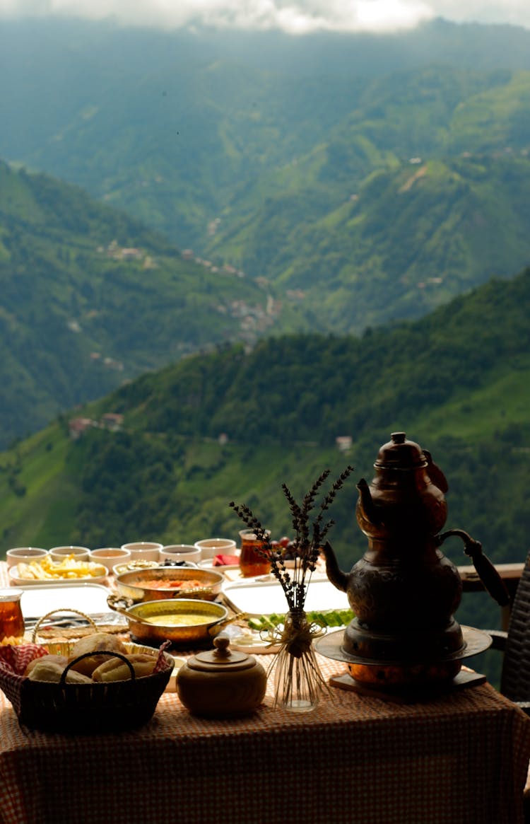 Food On A Table Overlooking A Green Valley