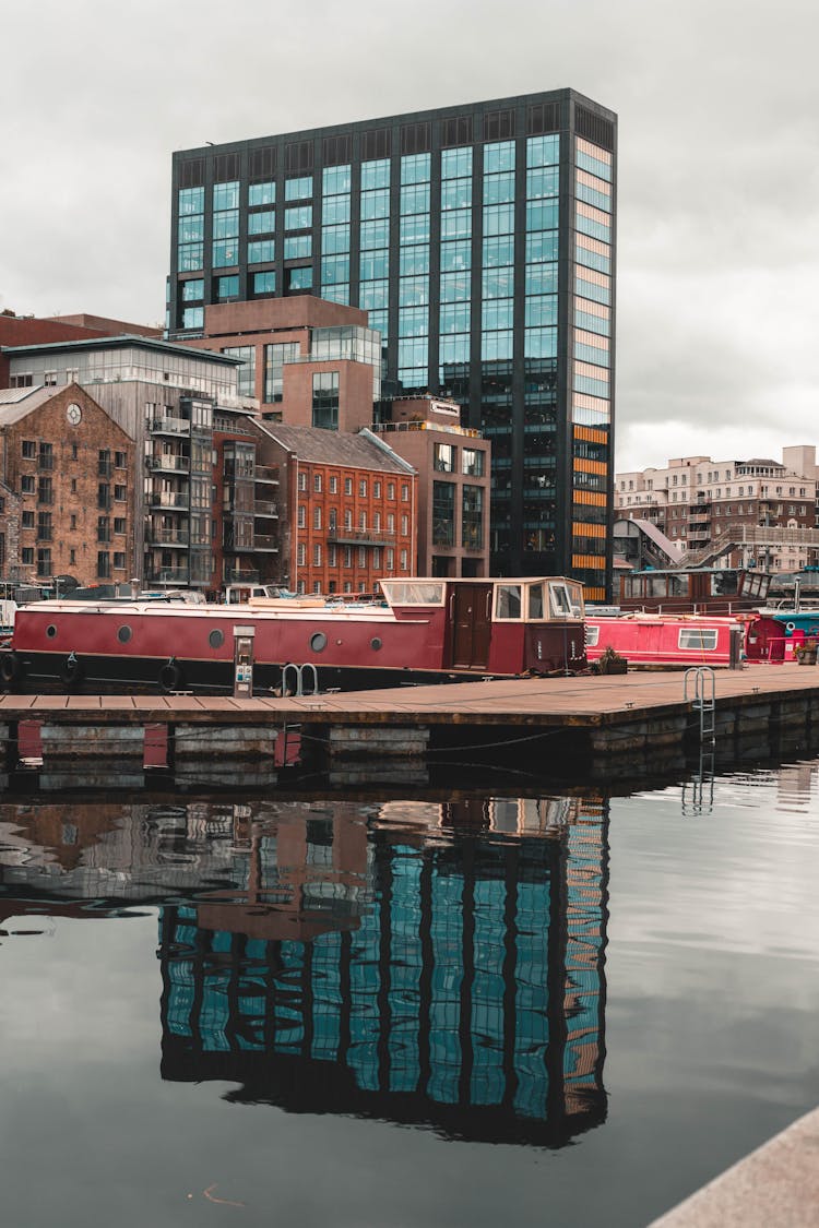 Modern Building Reflecting In Canal