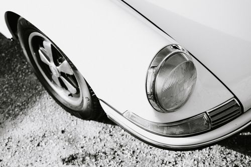 Free Close-up of a classic car's headlight in monochrome, highlighting its retro design. Stock Photo