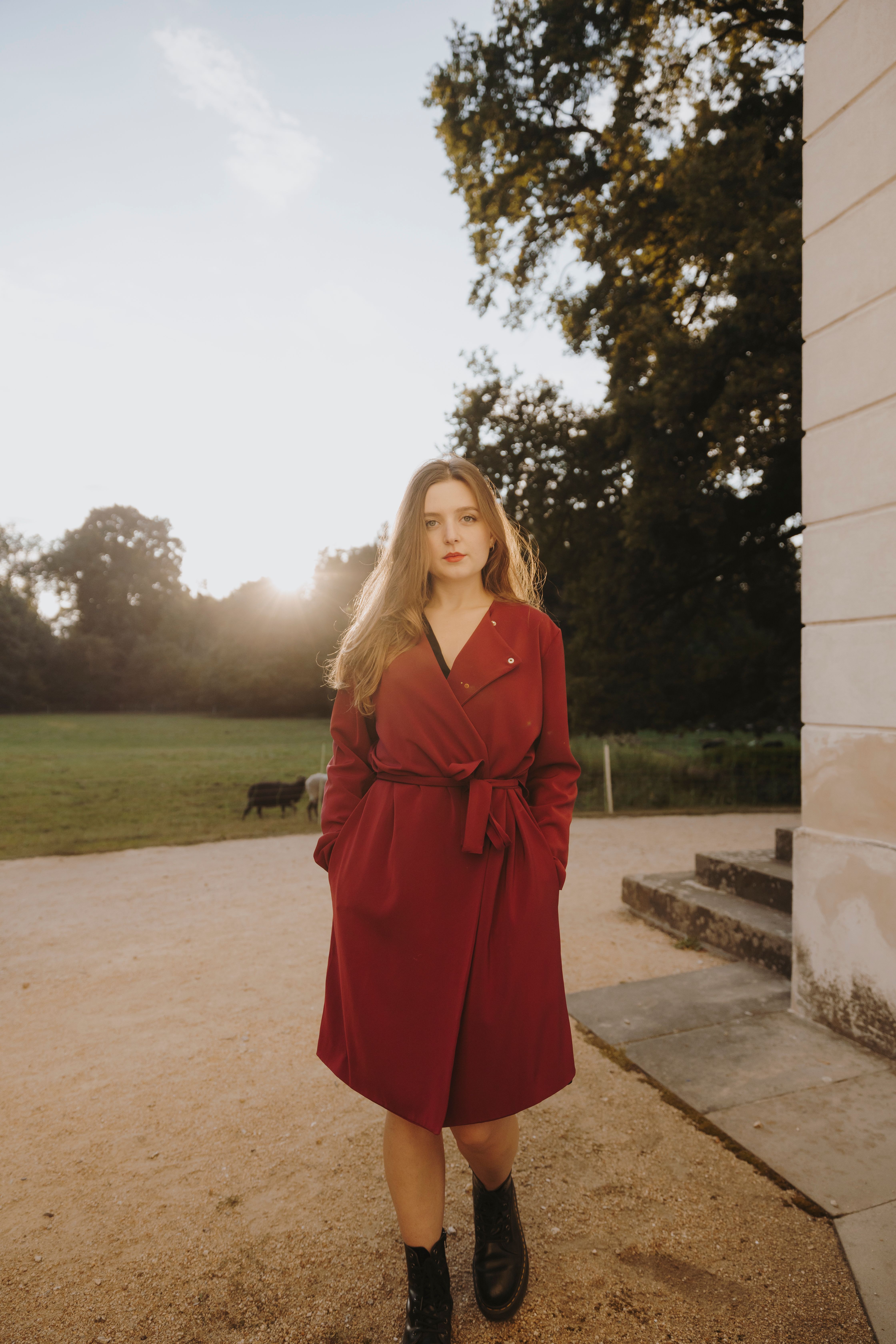 Back Lit Photo of a Woman Wearing a Red Coat · Free Stock Photo