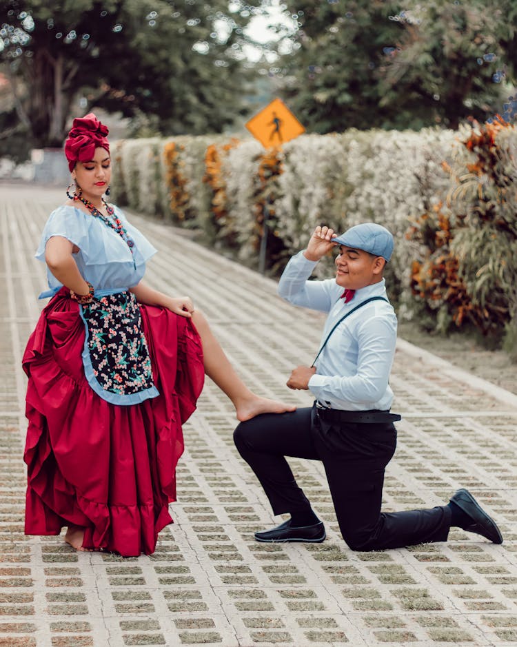 Couple Posing In Traditional Clothing