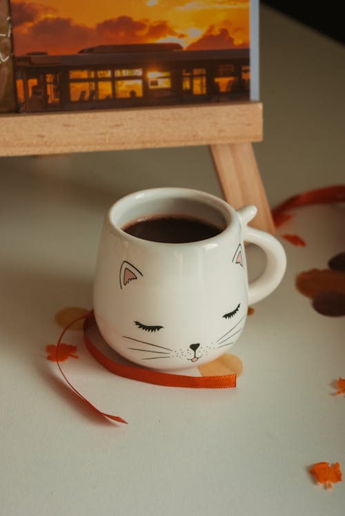 Free Still Life with Cat Face Porcelain Mug Stock Photo