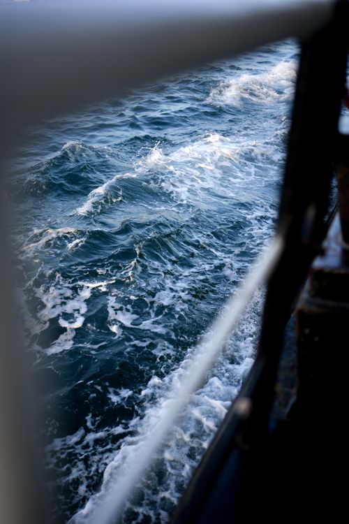 Free View of rough ocean waves from a ferry, emphasizing motion and water texture. Stock Photo