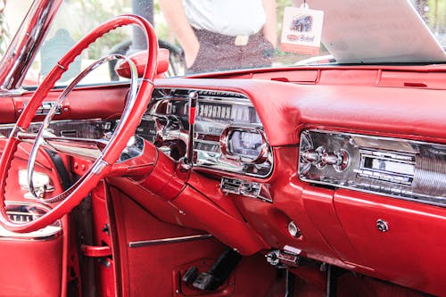 Steering Wheel and Dashboard of Red Classic Cadillac Car
