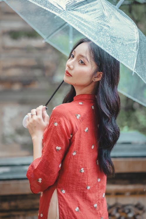 Woman in Red, Traditional Clothing and with Umbrella