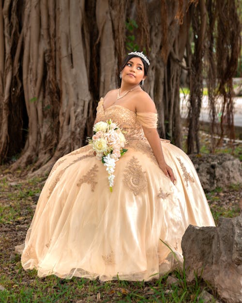 Bride Sitting near Tree