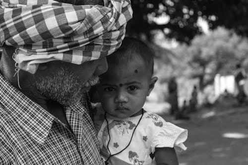 Father in Turban Holding Child