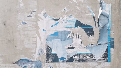 A painting with blue and white pieces of paper