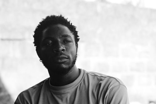 Free Striking black and white portrait of a man with short hair and beard, exuding a thoughtful expression. Stock Photo