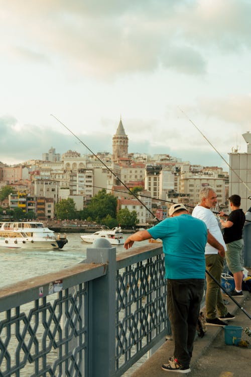 Men with Fishing Rods on a Bridge in Istanbul · Free Stock Photo