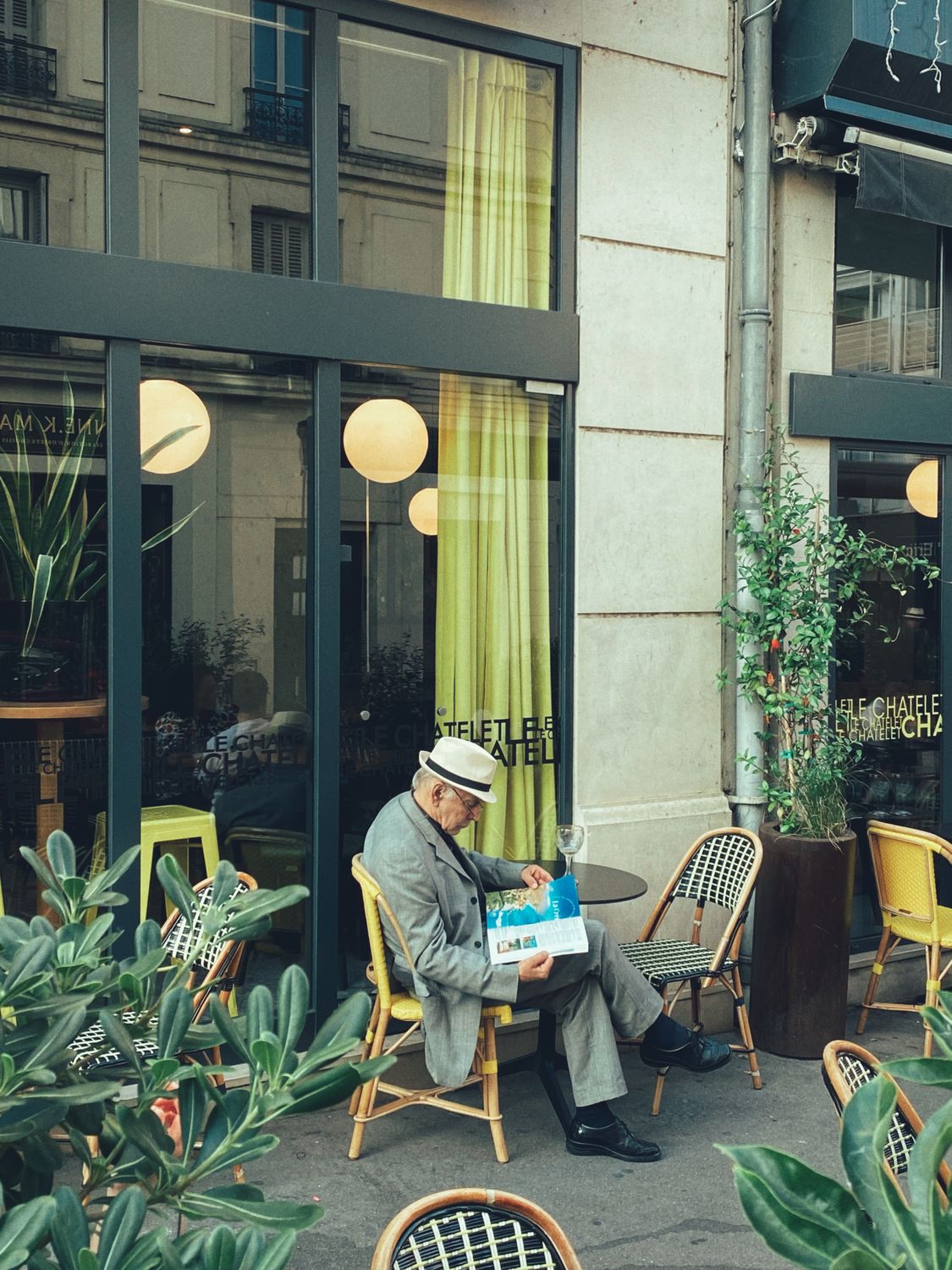 Cafe Man Rabbuca Man Sitting at Cafe and Reading · Free Stock Photo