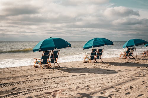 Deckchairs under Sunshades on Beach