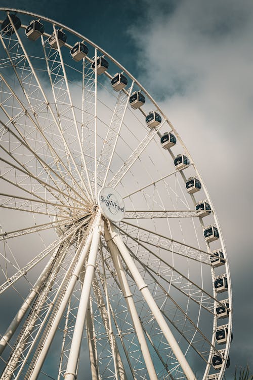 Ferris Wheel against Cloudy Sky