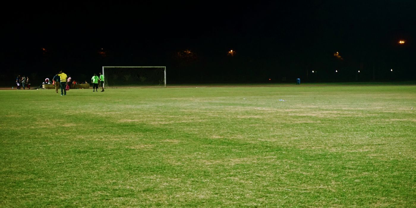 Floodlit soccer stadium at night during the 2026 World Cup summer