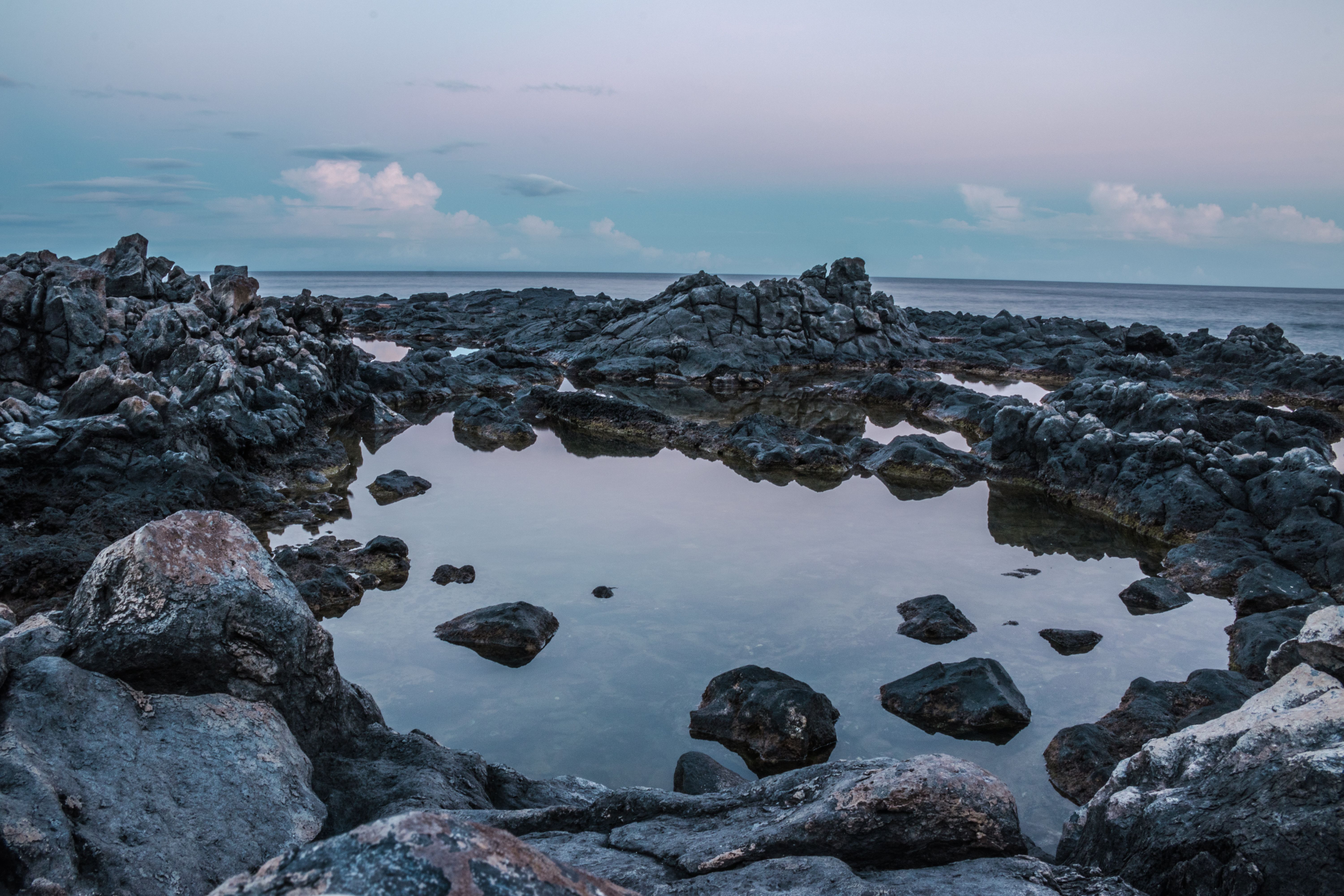 Rocks In Body Of Water · Free Stock Photo