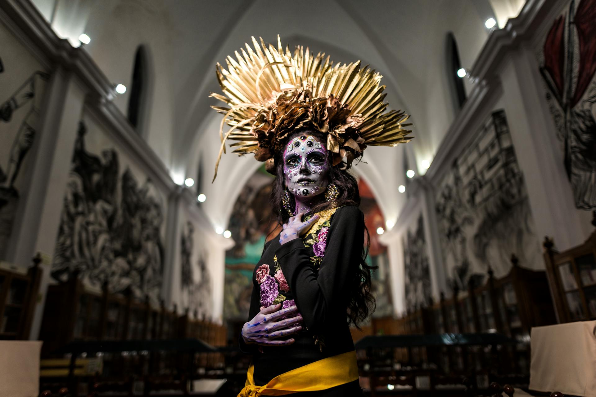 Woman Dressed for Mexican Death Festival Standing a Church