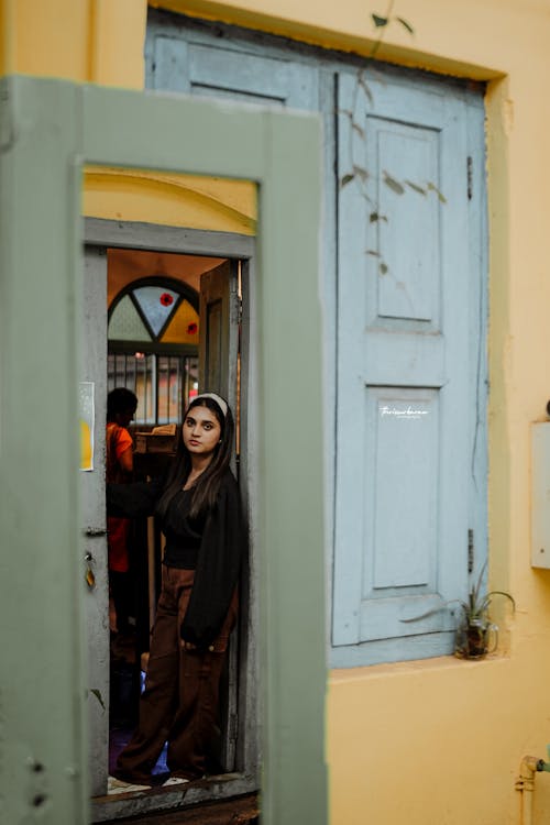 Young Woman Standing in the Doorway 