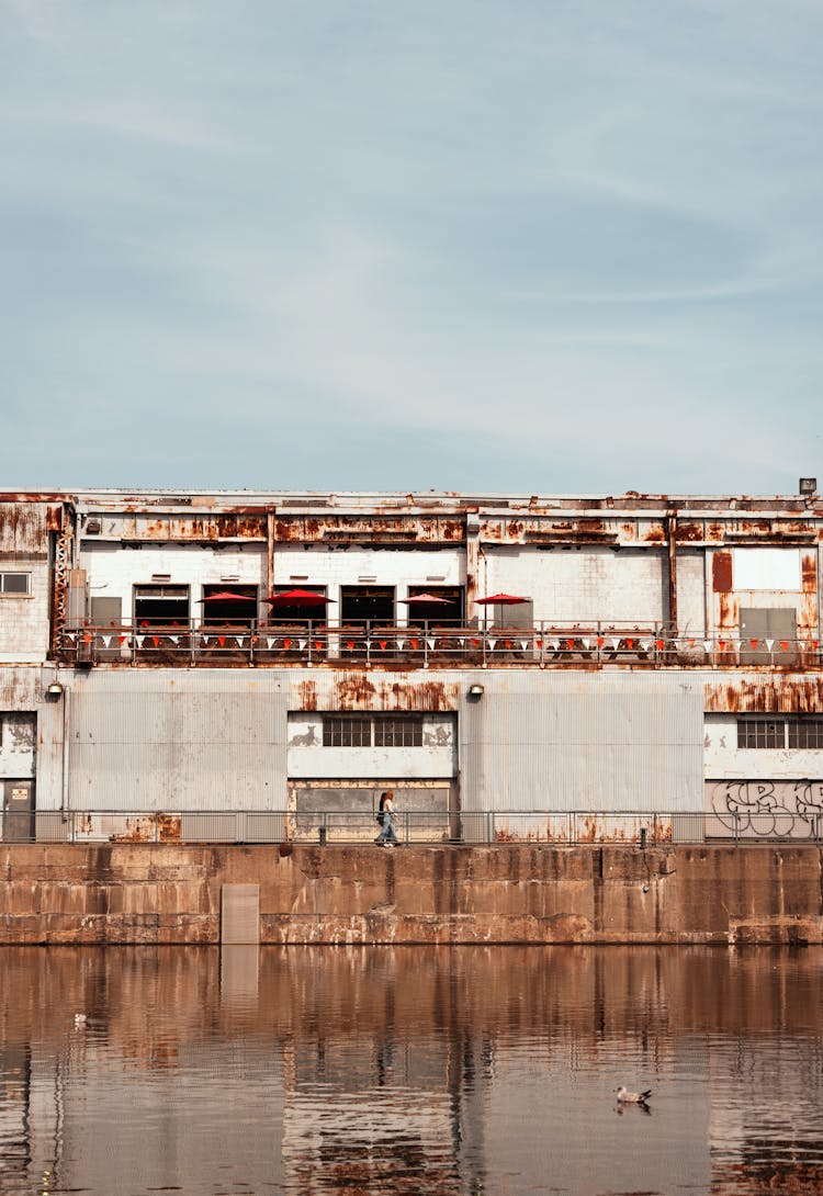 People Walking By Water In Building