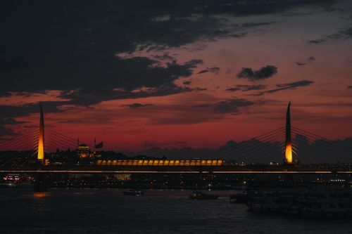 Free Stunning view of the illuminated Galata Bridge at dusk against a vibrant sky in Istanbul, Turkey. Stock Photo