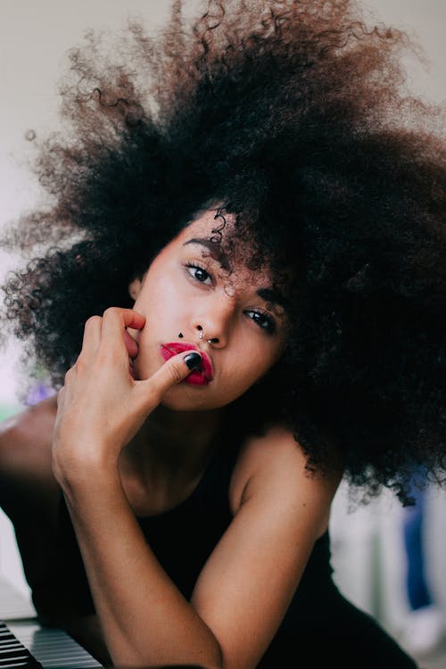 Free Photo of Posing Woman Touching Her Lips Stock Photo