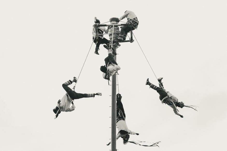 Black and white photo of Voladores de Papantla performing traditional ritual in Puebla, Mexico.