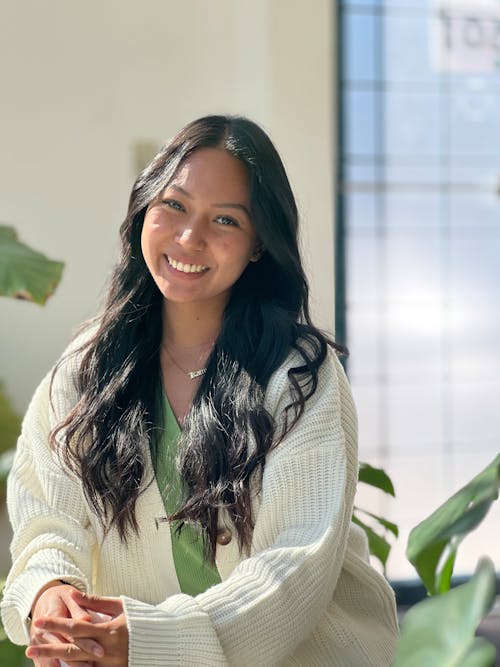 Smiling Brunette Woman in White Sweater