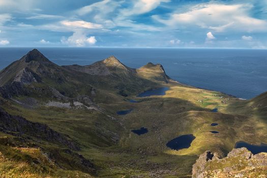 Discover the breathtaking landscapes of the Lofoten Archipelago with its majestic mountains and serene lakes.