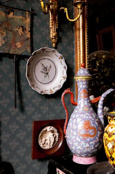 Elegant antique decor with ornate pottery and traditional art displayed indoors in Paris.