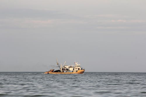 Fishing Boat Towing Boat on Open Sea