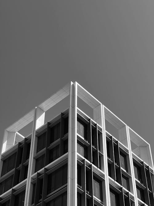 Modern Geometric Building against Sky Background
