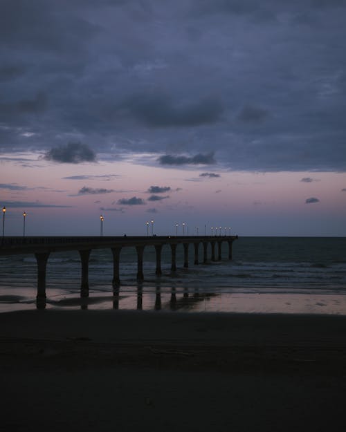 Pier on Seashore at Night