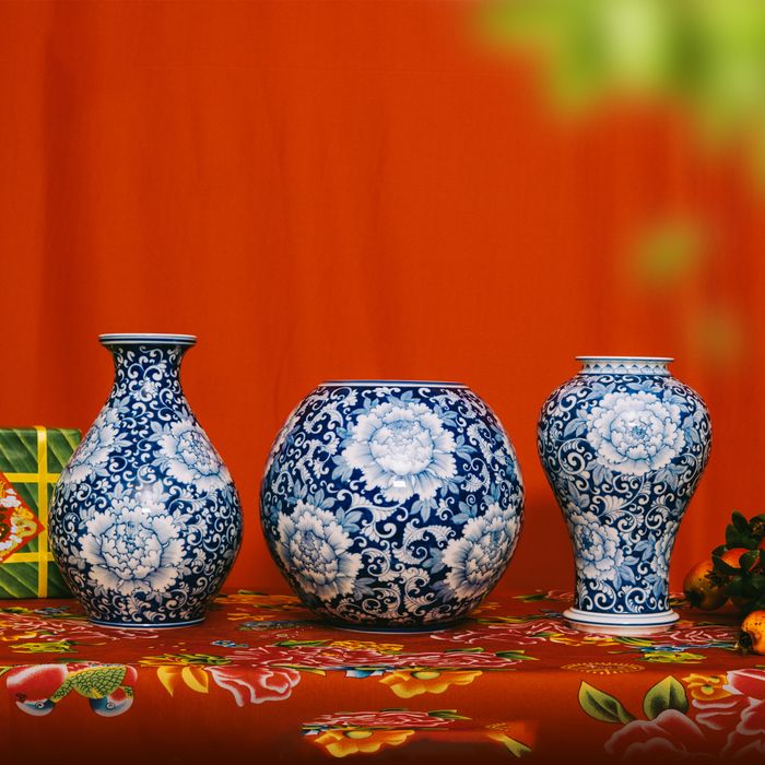 Three patterned vases against a red ground — Sứ Bát Tràng on Pexels