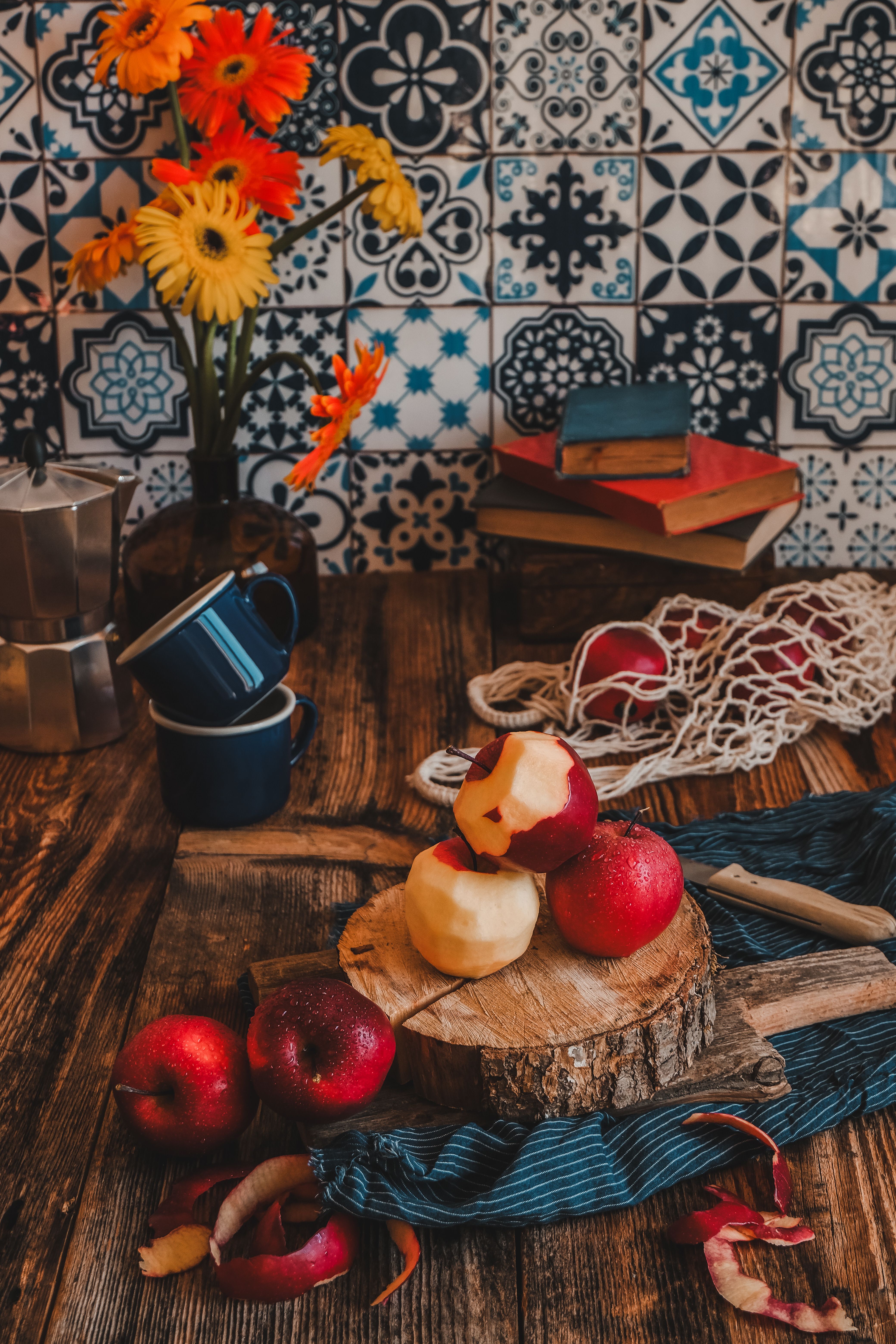 Rustic Kitchen Setting with Apples and Floral Decor · Free Stock Photo