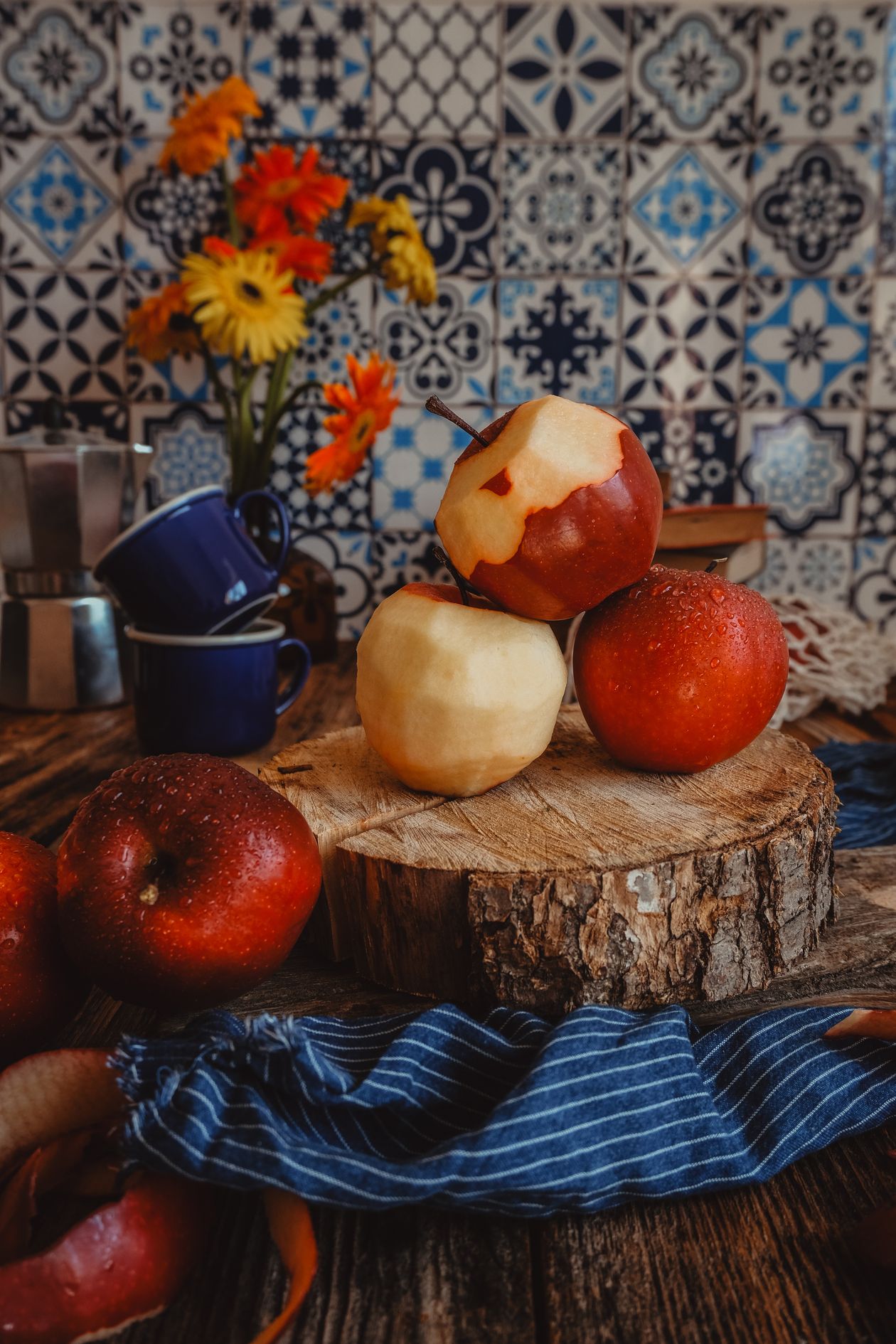 Apples styled in a farmhouse kitchen Red apples arranged in a rustic farmhouse kitchen scene