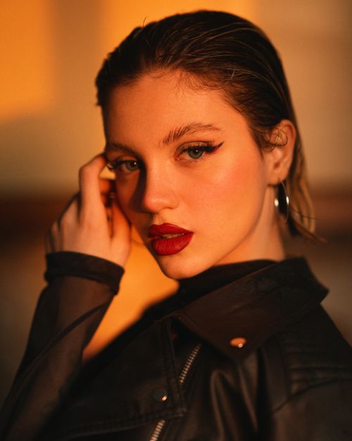 Free A striking portrait of a woman with elegant makeup, capturing the essence of modern glamour. Stock Photo