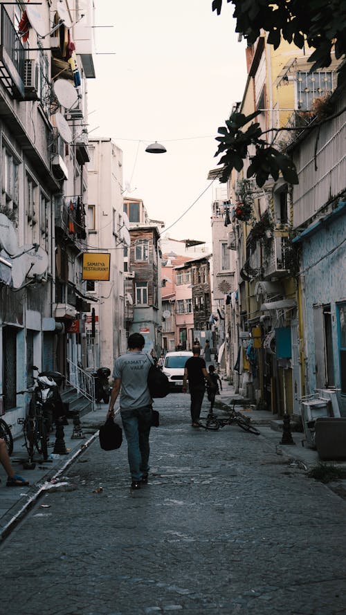 People Walking in a Narrow Street