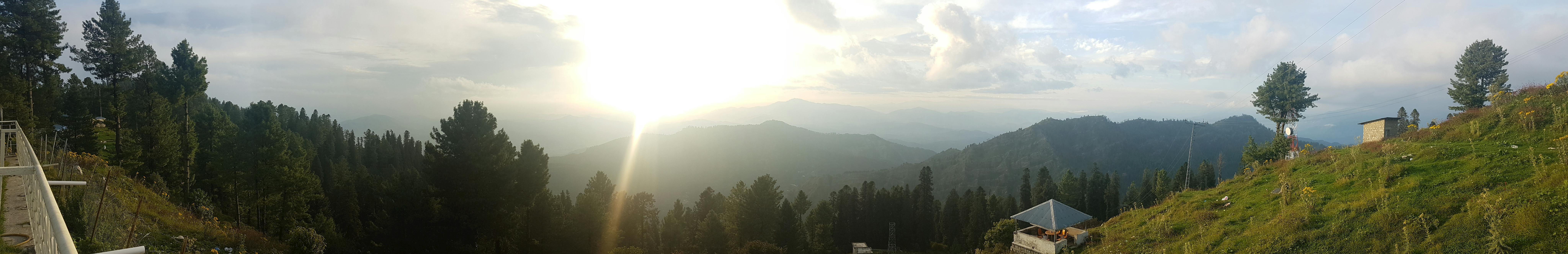 Running back carrying the football while being tackled