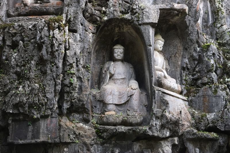Ancient Buddha statues carved into the rock at Lingyin Temple, Hangzhou