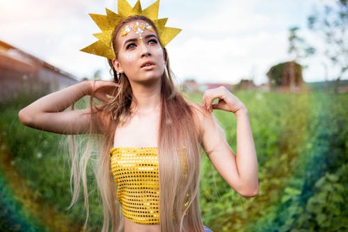 Woman Standing Beside Grass Field