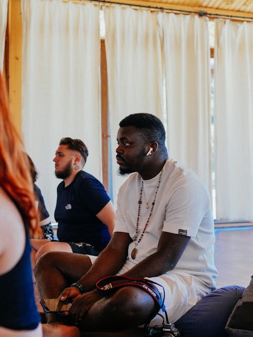 Man Sitting in White T-shirt