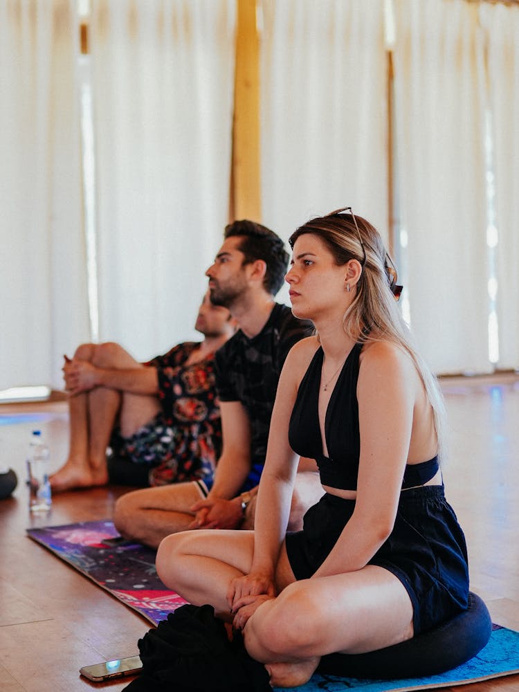 Woman And Men Sitting On Fitness Class