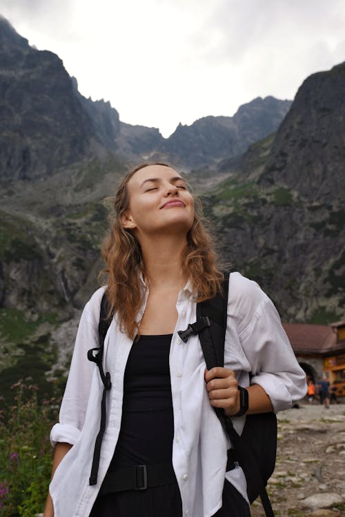 Blonde Woman in Mountains