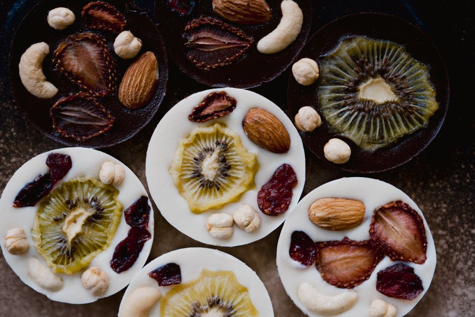 Wellness CORE vs Taste of the Wild: High Protein Dog Food Face-Off Vibrant chocolate discs topped with fresh fruit and nuts create a mouthwatering display.