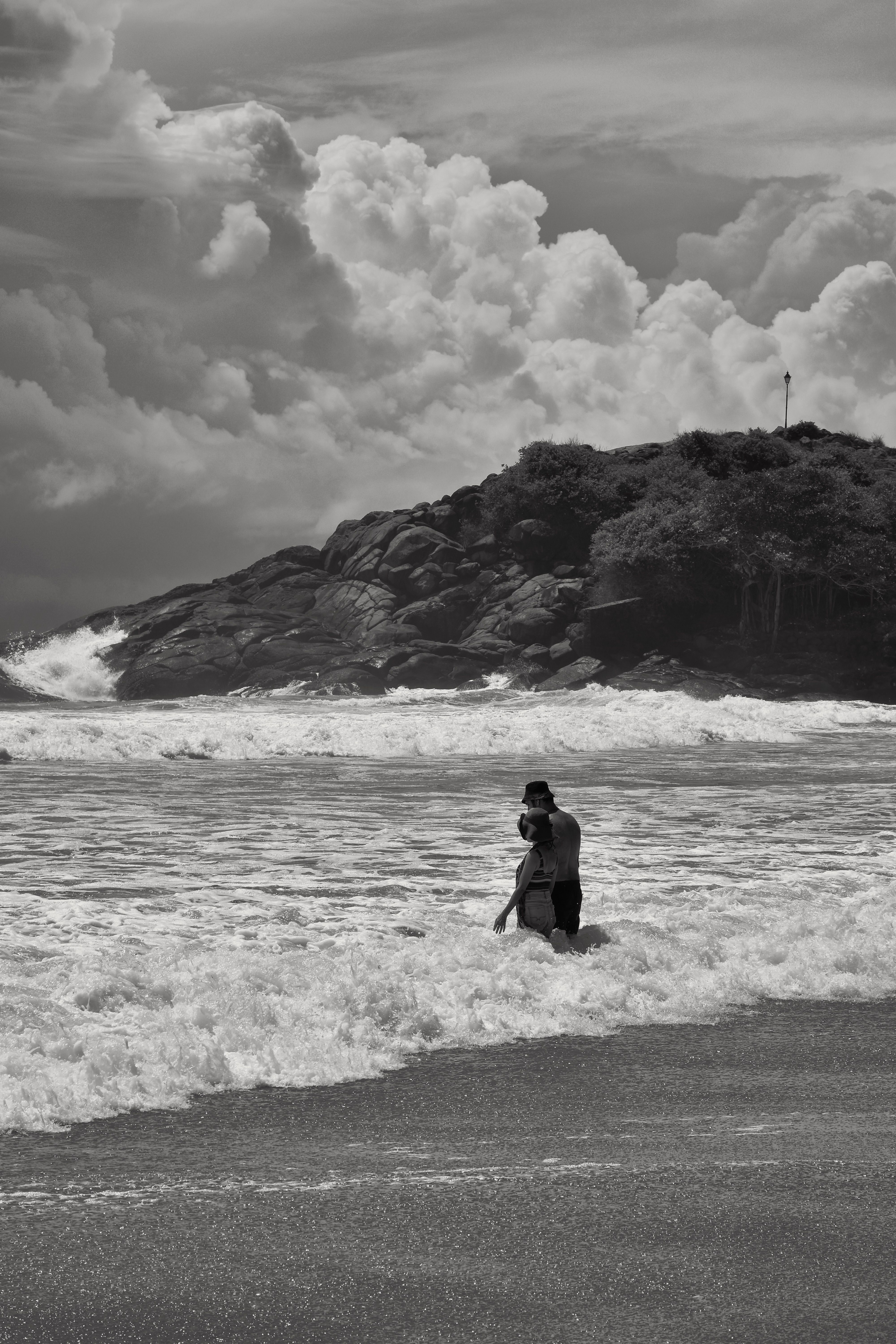 Couple on Sea Shore in Black and White · Free Stock Photo