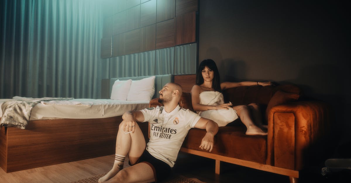 A couple enjoys a relaxing moment together in a stylish modern bedroom.