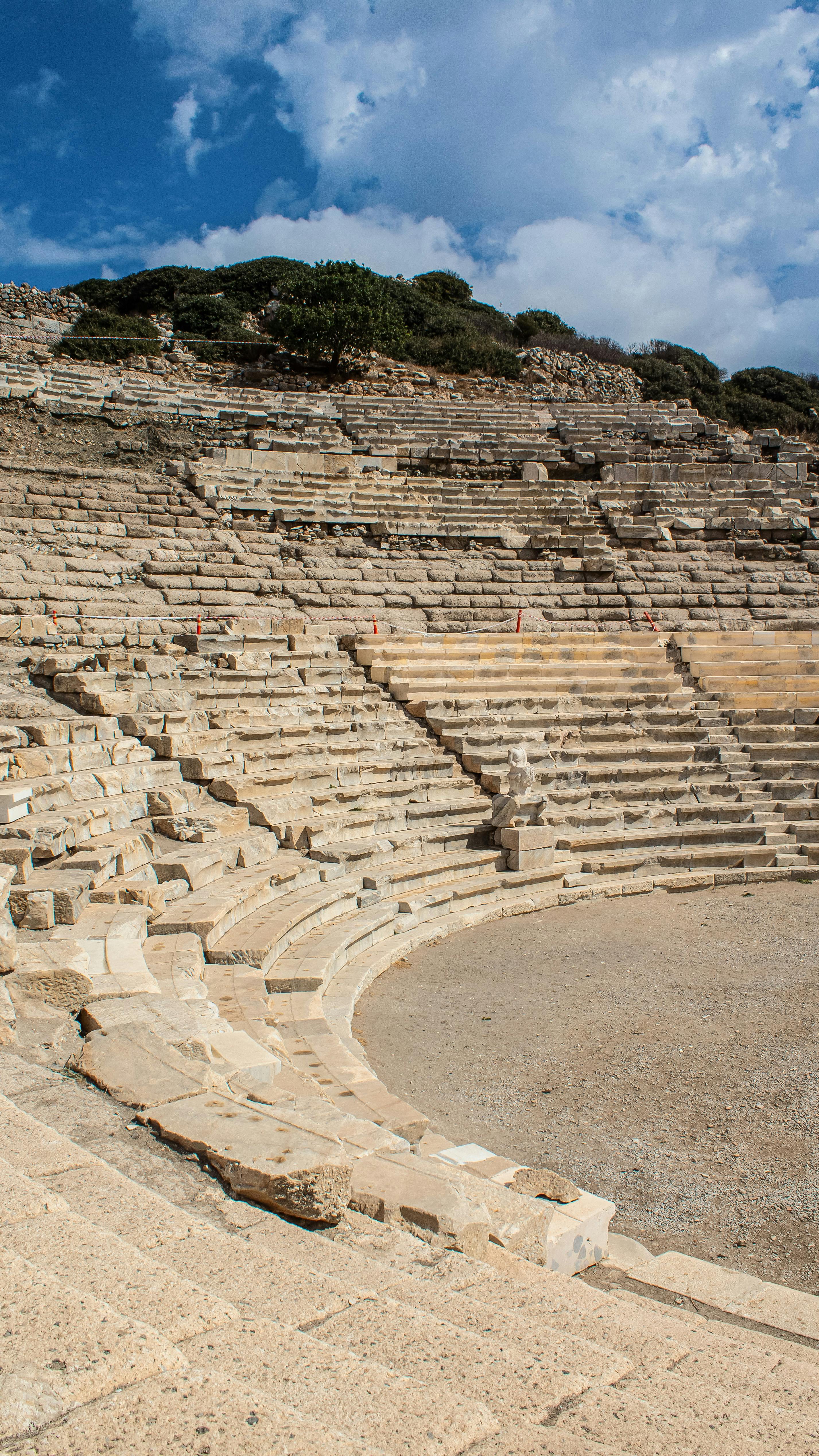 Free Explore the ancient stone theatre ruins in Yaka, Muğla, Türkiye, offering a glimpse into history. Stock Photo