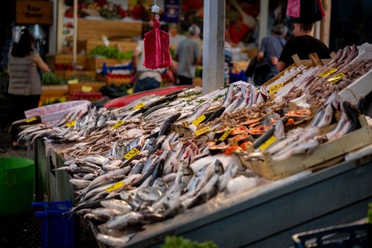A vibrant selection of fresh seafood displayed at a bustling market in İzmir, Türkiye.
